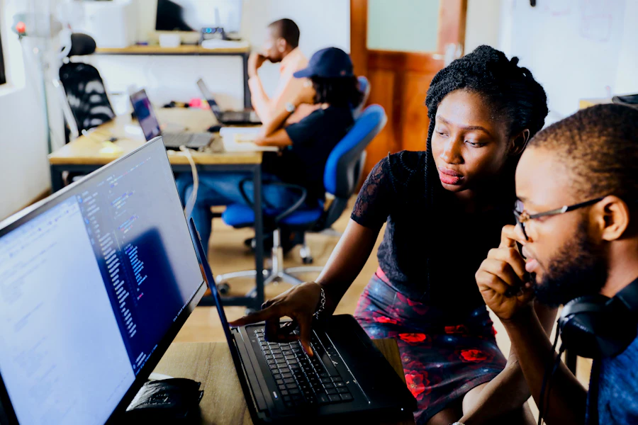 Engineers pairing at a workstation