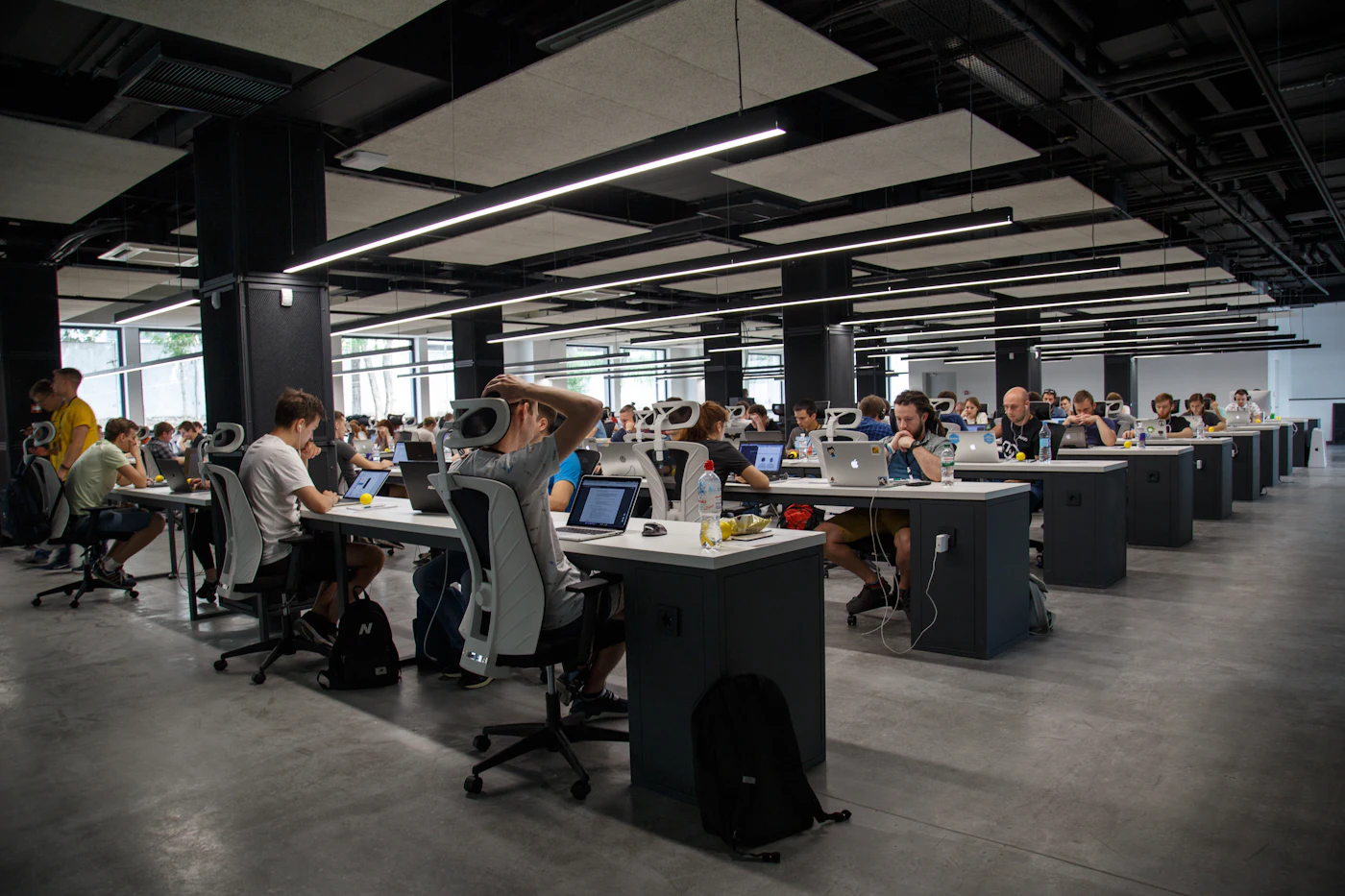 Large open-plan delivery center with many workstations